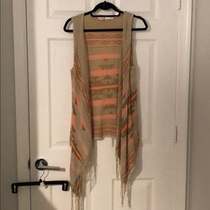 Tan and neon orange vest